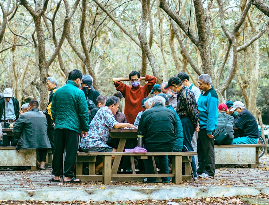 people sitting on brown wooden bench during daytime